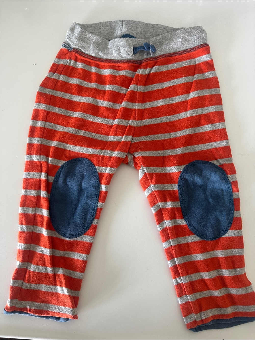 Baby boys orange & Gray Striped sweatpants reversing to solid blue